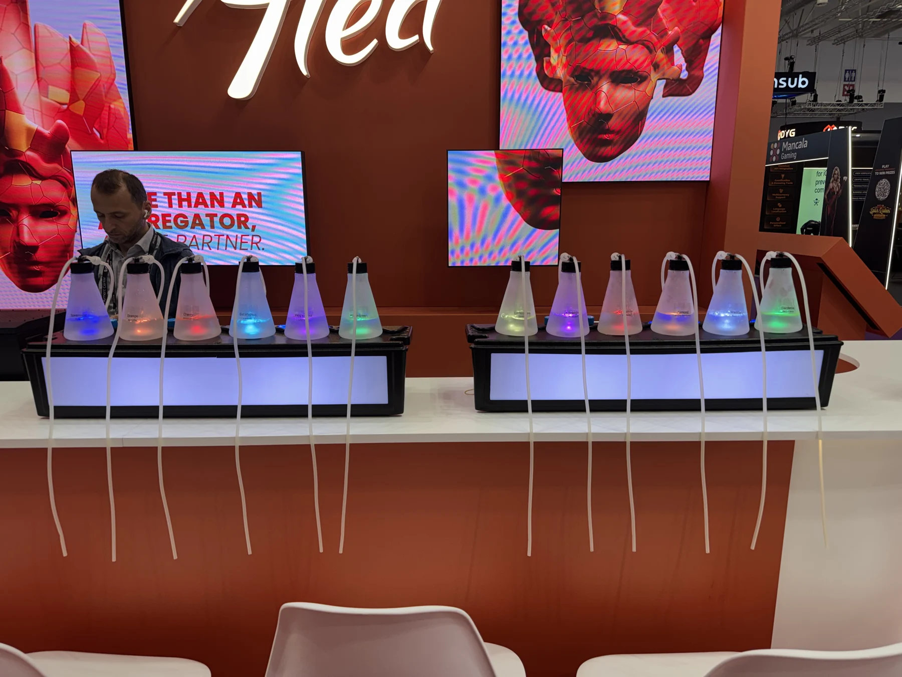 Twin aroma stations integrated into an orange exhibit counter