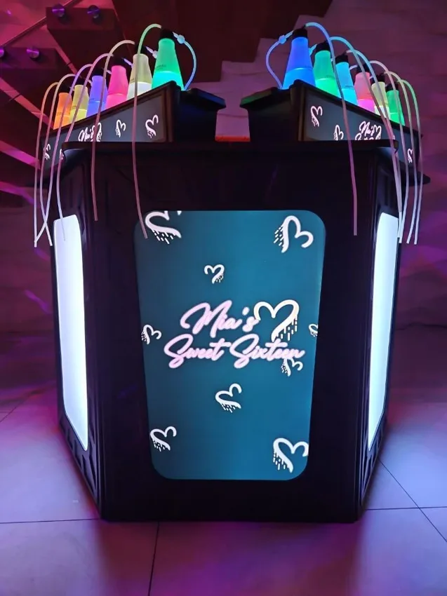 An illuminated celebration bar with custom script graphics